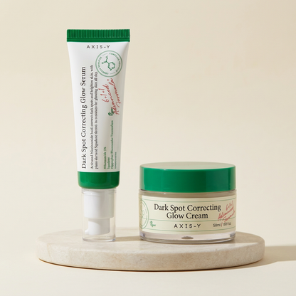 Dark spot duo set on a warm ivory studio background